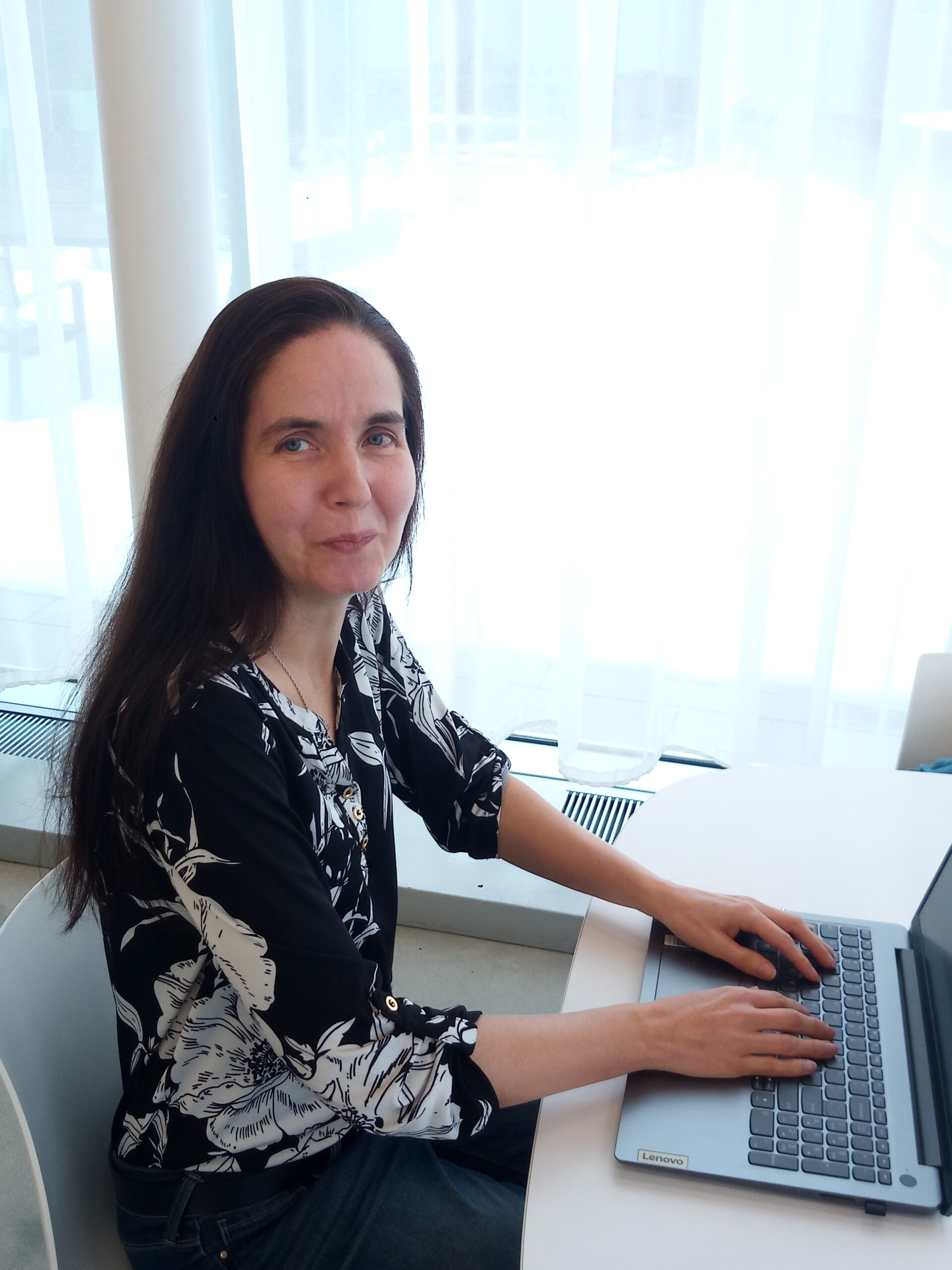 This is a picture of me typing my recipes up at the library. I love books and plant-based eating!